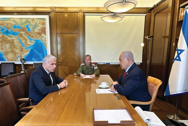  PRIME MINISTER Benjamin Netanyahu meets with opposition leader Yair Lapid at the Prime Minister’s Office in Jerusalem on Wednesday, to update him on Operation Shield and Arrow. The PM’s Military Secretary, Maj.-Gen. Avi Gil, also attended the meeting. (photo credit: GPO)