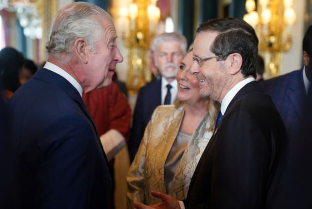 Britain's King Charles speaks with the President of Israel, Isaac Herzog and his wife Michal Herzog, during a reception for overseas guests attending his coronation at Buckingham Palace in London, Britain, May 5, 2023 (photo credit: REUTERS)
