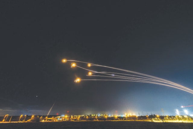 THE IRON Dome air defense system intercepts rockets fired from the Gaza Strip, as seen from Sderot, on Saturday. Over a thousand rockets were fired from the Gaza Strip, but the US wants Israel to stop.  (photo credit: YONATAN SINDEL/FLASH90)