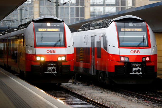  Two trains of the national rail company OeBB are seen during a warning strike in a railway station in Vienna, Austria November 26, 2018. (photo credit: REUTERS/LEONHARD FOEGER)