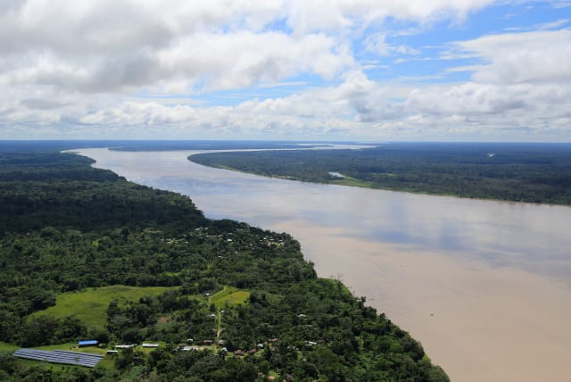  An aerial view of the Amazon river, before the signing of a document by Colombia's President Juan Manuel Santos that will allow for the conservation of the Tarapoto wetland complex in Amazonas, Colombia January 18, 2018. (photo credit: REUTERS/Jaime Saldarriaga)
