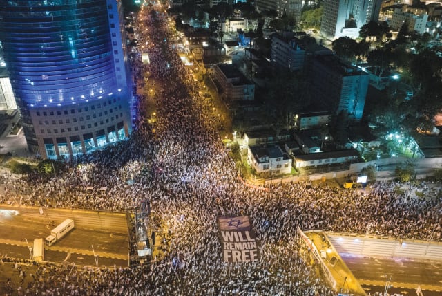  An aerial view shows people demonstrating against the government’s judicial overhaul plans in Tel Aviv on April 15, 2023.  (photo credit: ILAN ROSENBERG/REUTERS)