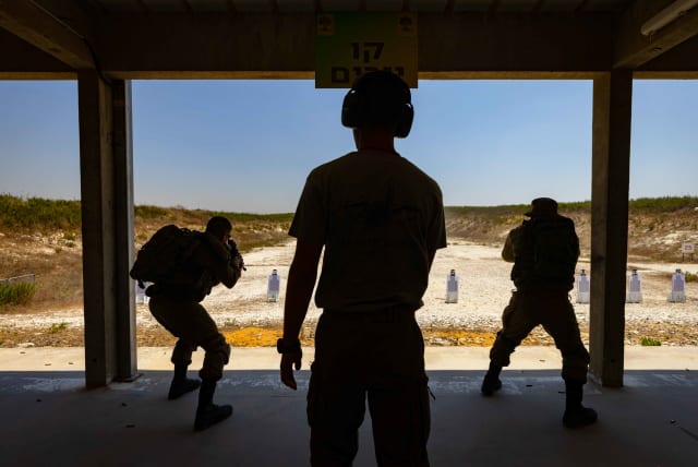  Israeli Golani soldiers seen during a firing training in a fire range at the Golani divisional training base, on August 1, 2021.  (photo credit: OLIVIER FITOUSSI/FLASH90)