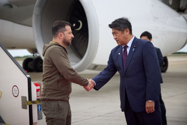  Ukraine's President Volodymyr Zelenskiy is greeted as he arrives at Hiroshima Airport to attend the G7 leaders' summit, in Mihara, Hiroshima prefecture, Japan May 20, 2023.  (photo credit: Ukrainian Presidential Press Service/Handout via REUTERS)