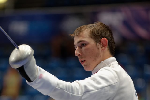  Israel's Yuval Shalom Freilich salutes during his bout against Ivan Trevejo from France in the table of 64 of the men's épée event in the 2013 World Fencing Championships 2013 at Syma Hall in Budapest, 8 August 2013. (photo credit: MARIE-LAN NGUYEN / WIKIMEDIA COMMONS)
