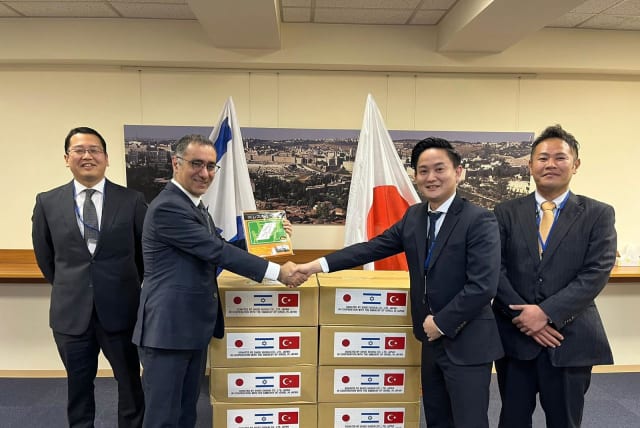  Israeli Ambassador to Japan Gilad Cohen is seen with representatives of Shoei Shokai with aid to send to Turkish earthquake victims. (photo credit: ISRAELI EMBASSY IN JAPAN)