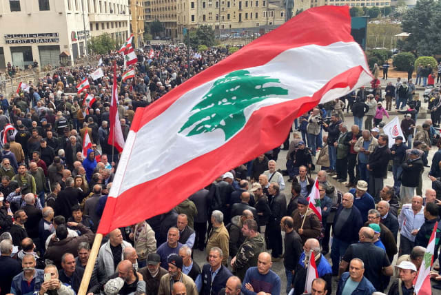  Demonstrators gather during a protest over the deteriorating economic situation, at Riad al-Solh square in Beirut, Lebanon March 22, 2023. (photo credit: REUTERS/MOHAMED AZAKIR)