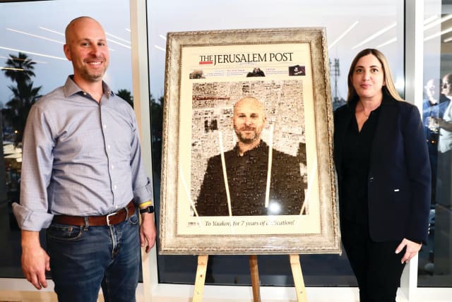 YAAKOV KATZ and Inbar Ashkenazi pose alongside the life-size portrait presented to Katz by the management of The Jerusalem Post Group.  (photo credit: MARC ISRAEL SELLEM/THE JERUSALEM POST)