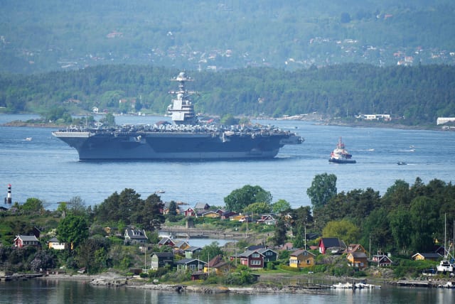  A view of the US aircraft carrier USS Gerald R. Ford in the Oslo Fjord, seen from Ekebergskrenten, Norway, May 24, 2023. (photo credit: JAVAD PARSA/NTB/via REUTERS)