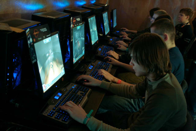  Illustrative image of men playing online games. (photo credit: FLICKR)