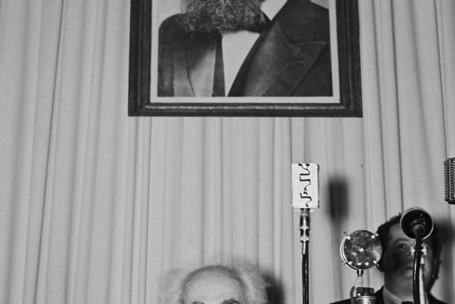  ISRAEL’S FIRST prime minister  David Ben-Gurion sits under a portrait of Theodor Herzl before the reading of the Declaration of Independence in Tel Aviv, May 14, 1948. (photo credit: Frank Scherschel/GPO)