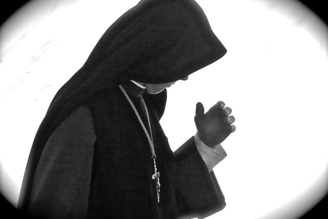  A Catholic nun is seen praying (Illustrative). (photo credit: Wikimedia Commons)
