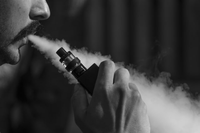  A person is seen vaping (Illustrative). (photo credit: PIXABAY)