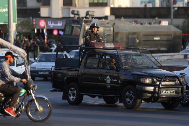  A riot police vehicle rides in a street in Tehran, Iran, October 3, 2022.  (photo credit: WANA VIA REUTERS)