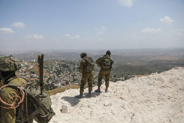 Israeli soldiers guard at the outpost of Homesh, in the West Bank, on May 29, 2023.  (photo credit: FLASH90)