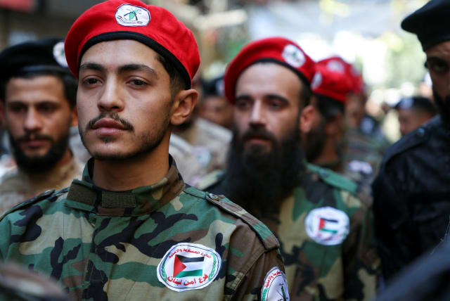  Members of the Popular Front for the Liberation of Palestine-General Command (PFLP-GC) march during a parade marking the annual al-Quds Day, (Jerusalem Day), at Burj al-Barajneh Palestinian refugee camp in Beirut, Lebanon April 14, 2023. (photo credit: MOHAMED AZAKIR/REUTERS)