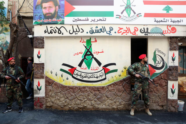  Members of the Popular Front for the Liberation of Palestine-General Command (PFLP-GC) stand guard during a parade marking the annual al-Quds Day, (Jerusalem Day), at Burj al-Barajneh Palestinian refugee camp in Beirut, Lebanon April 14, 2023. (photo credit: REUTERS/MOHAMED AZAKIR)