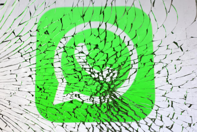  Whatsapp logo is seen through broken glass in this illustration taken, January 25, 2023. (photo credit: REUTERS/DADO RUVIC/ILLUSTRATION)