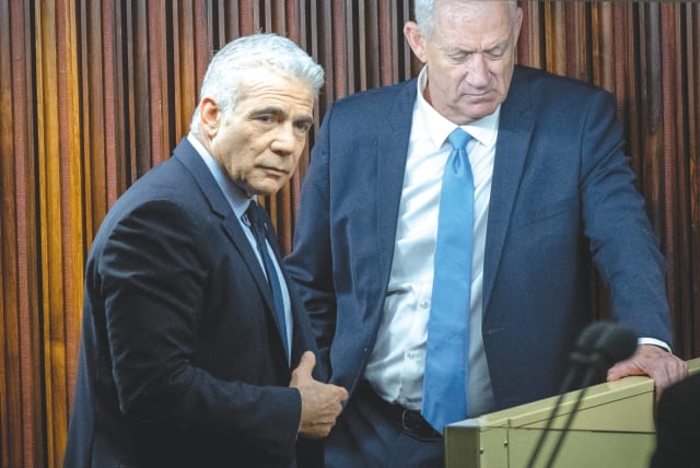  YESH ATID head MK Yair Lapid and National Unity head MK Benny Gantz seen in happier times and last month, in the Knesset.  (photo credit: YONATAN SINDEL/FLASH90)