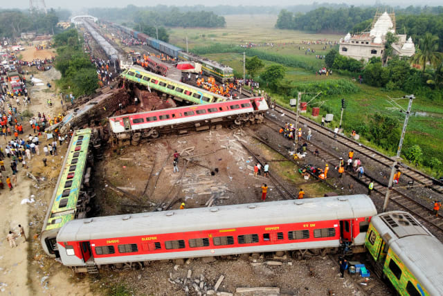  A drone view shows derailed coaches after two passenger trains collided in Balasore district in the eastern state of Odisha, India, June 3, 2023. (photo credit: REUTERS/STRINGER)
