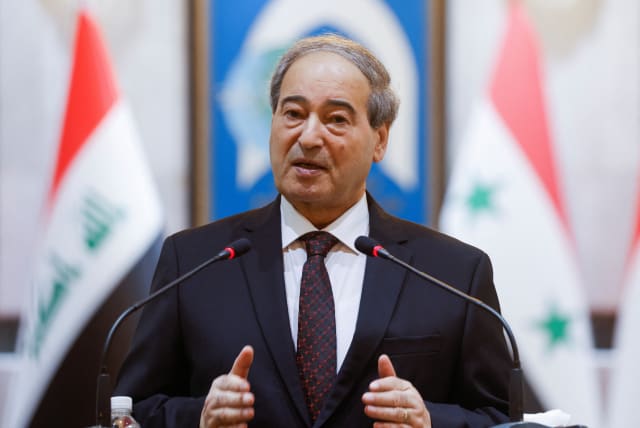  Syrian Foreign Minister Faisal Mekdad speaks during a joint press conference with Iraqi Foreign Minister Fuad Hussein (not pictured), in Baghdad, Iraq June 4, 2023.  (photo credit: REUTERS/AHMED SAAD)