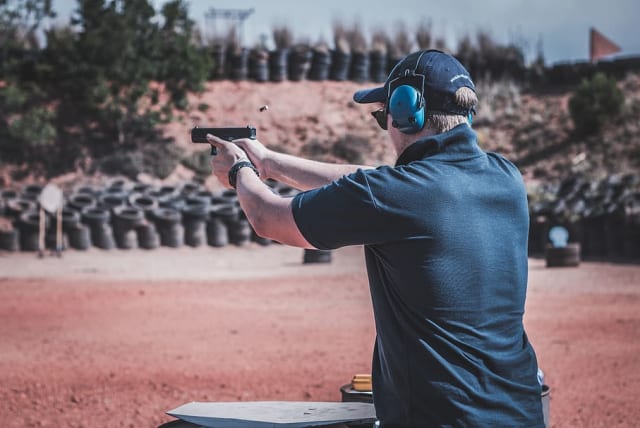  Illustrative image of a man at a shooting range. (photo credit: WALLPAPER FLARE)