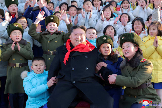  North Korean leader Kim Jong Un poses for a group photo with representatives of the Korean Children's Union (KCU) under North Korea's ruling Workers' Party in Pyongyang, North Korea (photo credit: REUTERS)