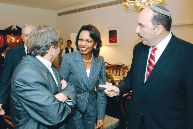  US SECRETARY of state Condoleezza Rice (C) speaks with Peres Center for Peace director-general Ron Pundak in Herzliya, 2007. At R: ambassador Dore Gold, former Israeli ambassador to the UN. (photo credit: Matty Stern/US Embassy/Handout/Reuters)