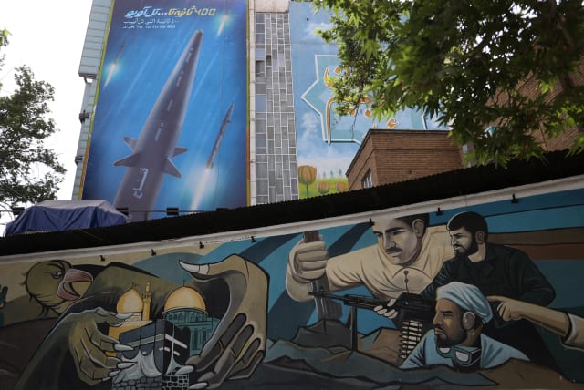  A billboard with a photo of a new hypersonic ballistic missile called "Fattah" and with text reading "400 seconds to Tel Aviv" is seen on a building in Tehran, Iran June 8, 2023. (photo credit: Majid Asgaripour/West Asia News Agency/Reuters)