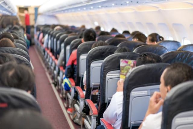 You won't get anywhere any faster by standing up before the plane reaches the port, flight attendants say. (photo credit: Walla)
