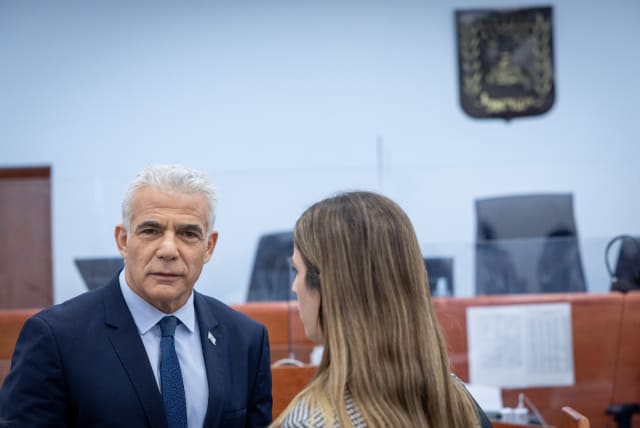 Opposition leader and former prime minister Yair Lapid arrives to testify in the trial against Israeli prime minister Benjamin Netanyahu at the District Court in Jerusalem on June 13, 2023.  (photo credit: YONATAN SINDEL/FLASH90)