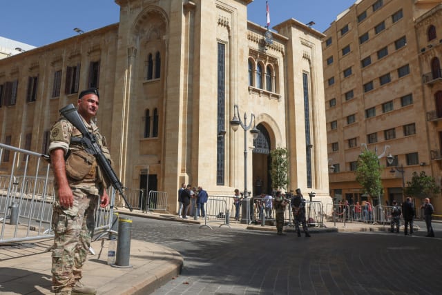  A member of the Lebanese army stands guard as Lebanon's parliament is set to convene in a bid to elect a head of state to fill the vacant presidency, in downtown Beirut, Lebanon June 14, 2023. (photo credit: REUTERS/MOHAMED AZAKIR)