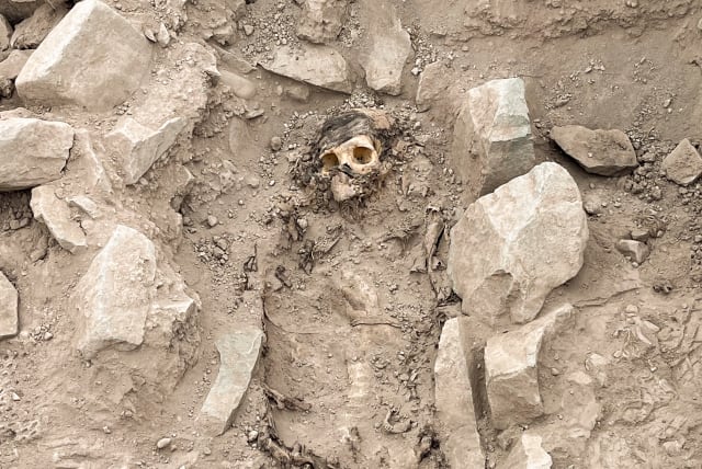  The remains of a mummy, believed to be from the Manchay culture which developed in the valleys of Lima between 1,500 and 1,000 BCE, are pictured at the excavation site of a pre-Hispanic burial, in Lima, Peru June 14, 2023. (photo credit: REUTERS/Anthony Marina)