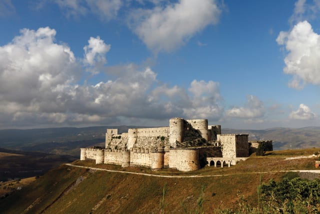  THE CRUSADER castle of Crac des Chevaliers in Homs province, Syria, in 2016. The novel takes place during the Crusader era.  (photo credit: OMAR SANADIKI/REUTERS)