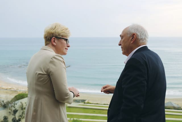 LITHUANIAN PRIME MINISTER Ingrida Simonyte and Chemi Peres, chairman of the Peres Center for Peace and Innovation, chat as they overlook the sea directly below the Peres Center in Jaffa. (photo credit: COURTESY PERES CENTER)