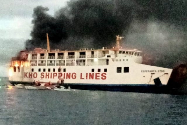  Smoke rises due to a massive fire at a ferry in Bohol, Philippines, June 18, 2023 in this handout image.  (photo credit: PHILIPPINE COAST GUARD/HANDOUT VIA REUTERS)