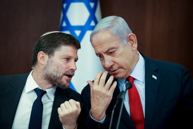  Israeli Prime Minister Benjamin Netanyahu speaks with Israeli Finance Minister Bezalel Smotrich at a cabinet meeting at the Prime Minister's Office in Jerusalem on June 18, 2023. (photo credit: AMIT SHABI/POOL)