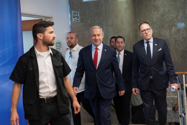  Israeli Prime Minister Benjamin Netanyahu, center, arrives to chair a cabinet meeting at the prime minister's office in Jerusalem, June 18, 2023. (photo credit: Ohad Zwigenberg/Pool via REUTERS)