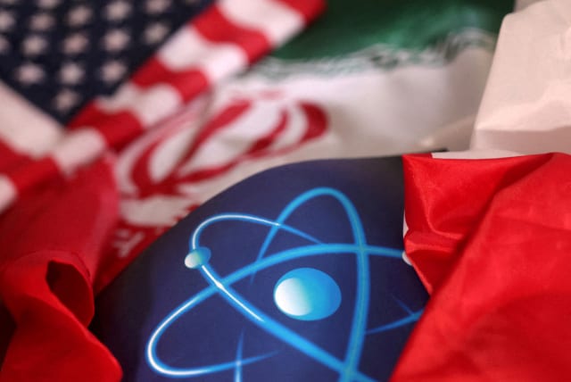  Atomic symbol and USA and Iranian flags are seen in this illustration taken, September 8, 2022. (photo credit: DADO RUVIC/REUTERS ILLUSTRATION)