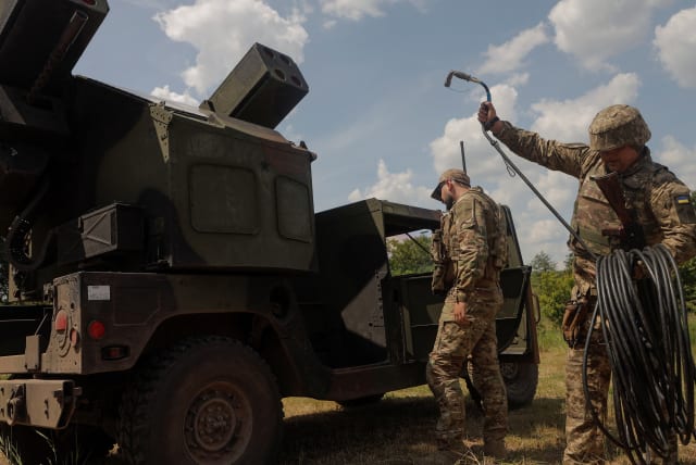  Ukrainian servicemen prepare an AN/TWQ-1 Avenger mobile air defence missile system for work during their combat shift, amid Russia's attack on Ukraine, outside of Kyiv, Ukraine June 16, 2023 (photo credit: REUTERS/ANNA VOITENKO)