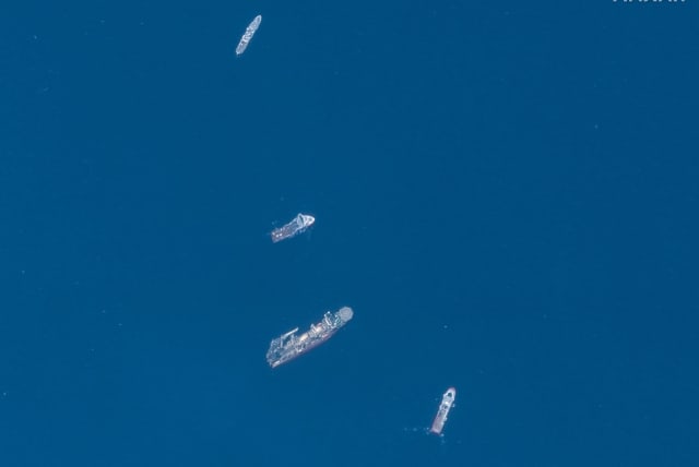 A satellite image shows ships taking part in the search and rescue operations associated with the missing Titan submersible near the wreck of the Titanic, June 22, 2023. (photo credit: MAXAR TECHNOLOGY/HANDOUT VIA REUTERS)