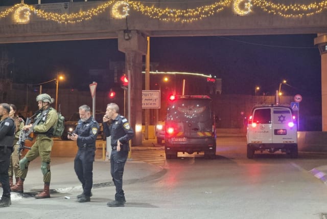 Police arrive at the scene where a security guard was slightly injured in a shooting incident with an attacker who walked on foot to the Kalandiya checkpoint from the West Bank, June 24, 2023. (photo credit: POLICE SPOKESPERSON'S UNIT)