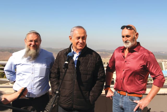  PRIME MINISTER Benjamin Netanyahu is flanked by the writer (left) and Jordan Valley Regional Council head David Elhayani, in 2019. (photo credit: GERSHON ELINSON/FLASH90)