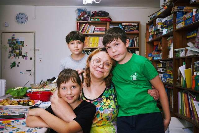  Volunteer Lena Dubrovin with children in her apartment, a shelter for numerous Russian and Ukrainian refugees since the start of the war, June 21, 2023.  (photo credit: DARIO SANCHEZ/THE MEDIA LINE)