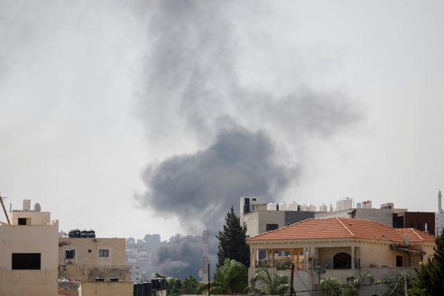  Smoke rises during an Israeli military operation in Jenin, in the West Bank July 3, 2023.  (photo credit: RANEEN SAWAFTA/REUTERS)