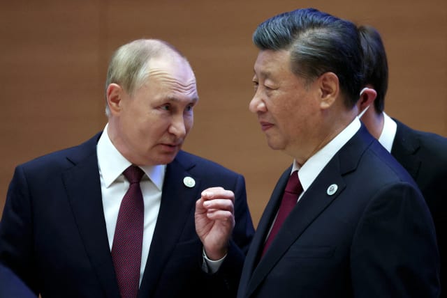  Russian President Vladimir Putin speaks with Chinese President Xi Jinping before an extended-format meeting of heads of the Shanghai Cooperation Organization summit (SCO) member states in Samarkand, Uzbekistan September 16, 2022. (photo credit: Sputnik/Sergey Bobylev/Pool via REUTERS)