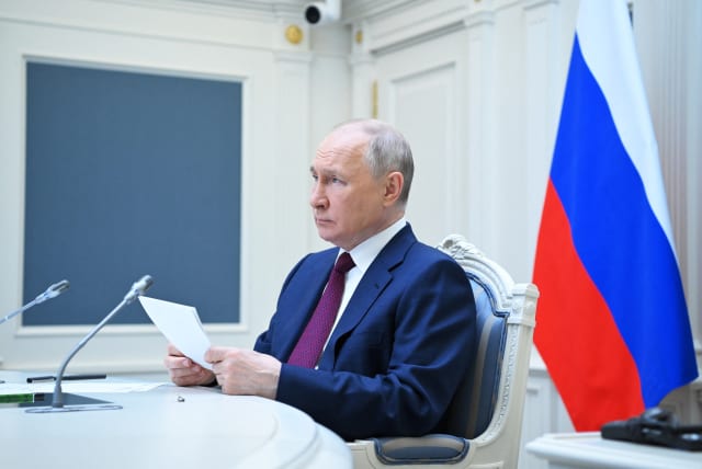  Russian President Vladimir Putin attends a summit of leaders of the Shanghai Cooperation Organisation (SCO) via a video conference call at the Kremlin in Moscow, Russia, July 4, 2023.  (photo credit: Sputnik/Alexander Kazakov/Kremlin via REUTERS)