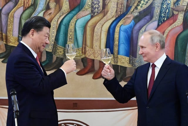  Russian President Vladimir Putin and Chinese President Xi Jinping attend a reception at the Kremlin in Moscow, Russia March 21, 2023.  (photo credit: Sputnik/Pavel Byrkin/Kremlin via REUTERS)