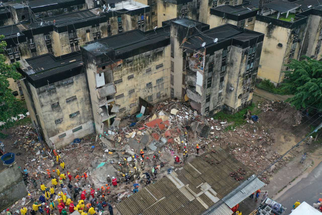  Rescue workers look for victims among debris of a building collapse in Recife, Pernambuco state, Brazil July 7, 2023. (photo credit: REUTERS/ANDERSON STEVENS)