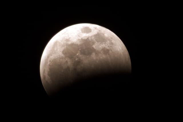  The moon is seen during a lunar eclipse in the sky over Volcano Irazu, in Cartago 40 miles from the capital San Jose, late May 15, 2003. Costa Ricans watched the lunar eclipse the first of two this year. (photo credit: JUAN CARLOS ULATE / REUTERS)